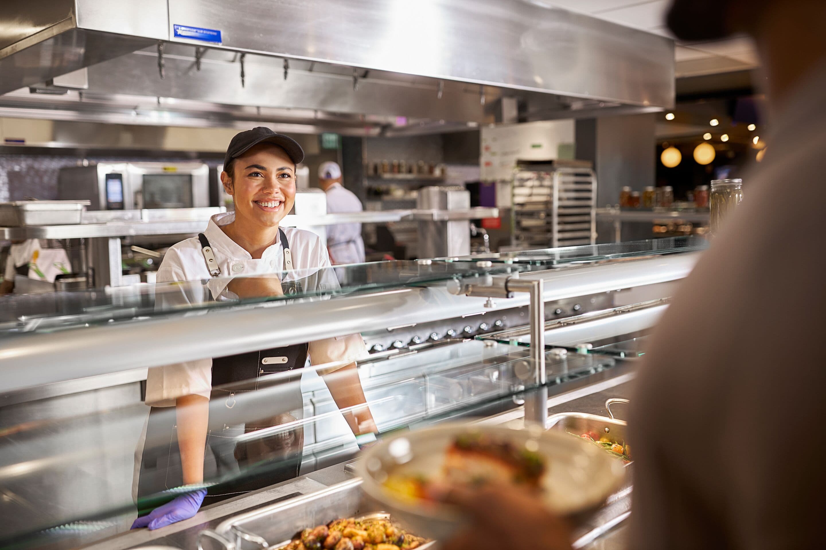 Placemaker greeting a guest at the food service counter