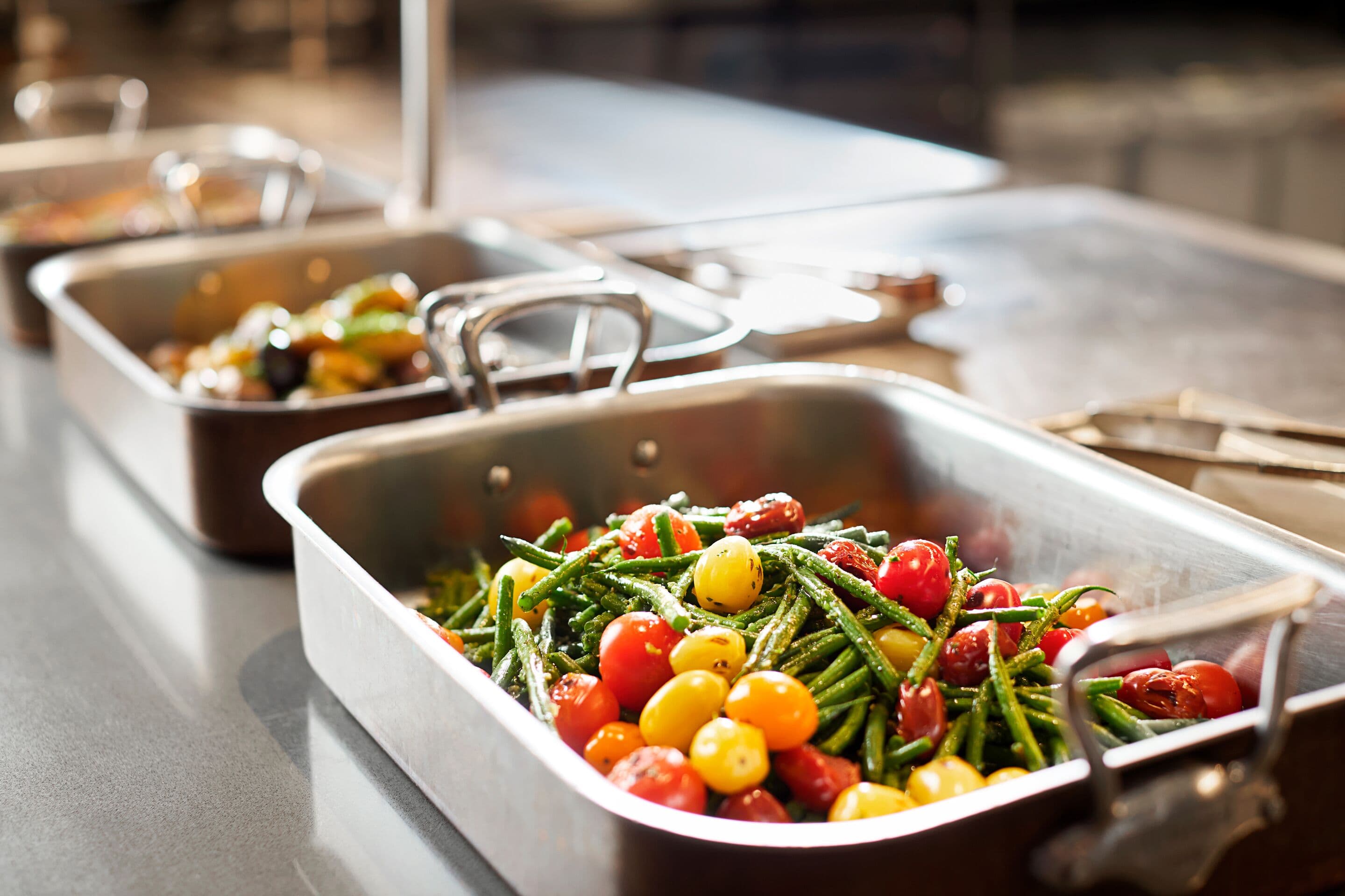 Catering tray of colorful tomatoes and green beans